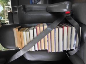 My daughter took this photo after a library visit.  If the books were turned around so the titles were visible, her sophomore Pre-AP English teacher would have been appalled at the types of books Courtney was reading because they weren't considered good literature in her eyes.  That teacher never cared that Courtney was an avid reader outside of school, only that she didn't like to fill out the worksheets and read the assigned readings for class the way her teacher wanted her to. Luckily Courtney never cared what that teacher thought and continues to devour YA fiction anyway.