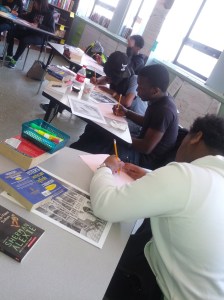 Calmly, yet intensely, sketching.