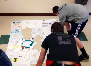 Students piece together their final book talk puzzle.